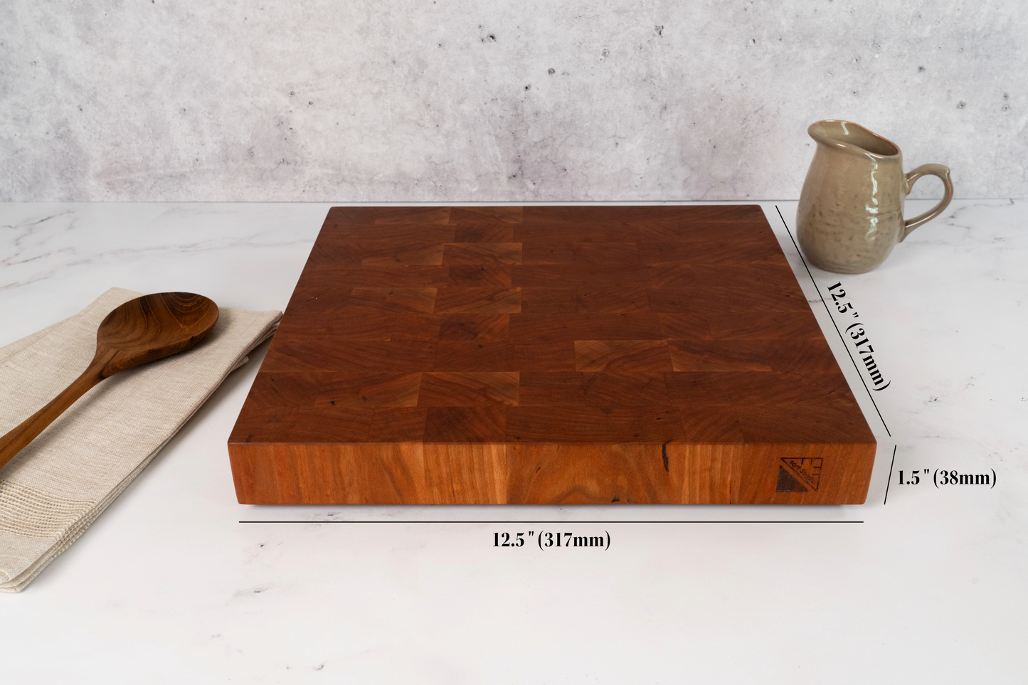 Cherry square 12.5 x 12.5 inches cutting board on a marble kitchen counter top, thick branded cherry cutting board with dimensions, mm dimensions available too