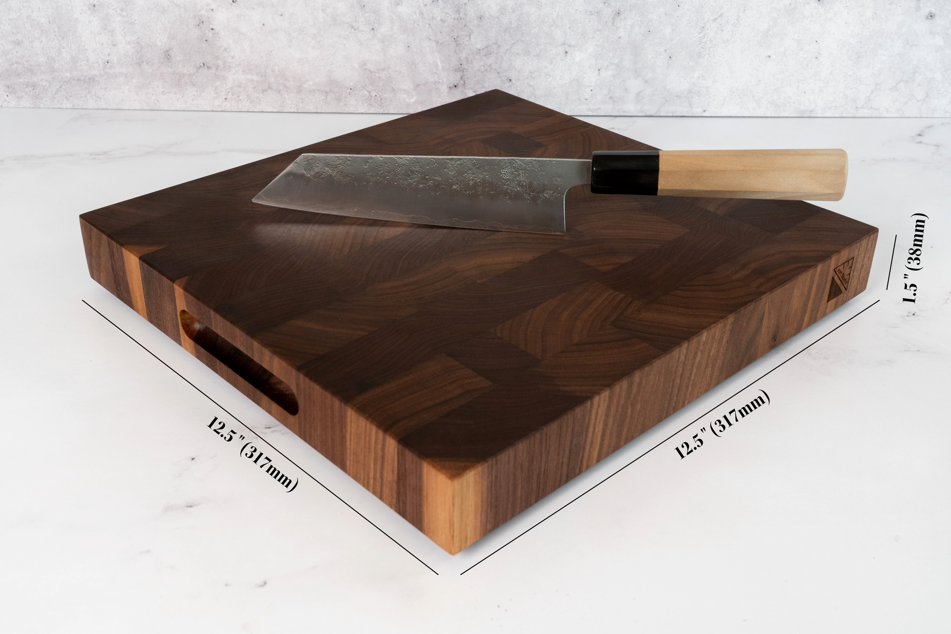 Black American walnut square 12.5 x 12.5 inches cutting board on a marble kitchen counter top, thick branded walnut cutting board with dimensions, mm dimensions available too
