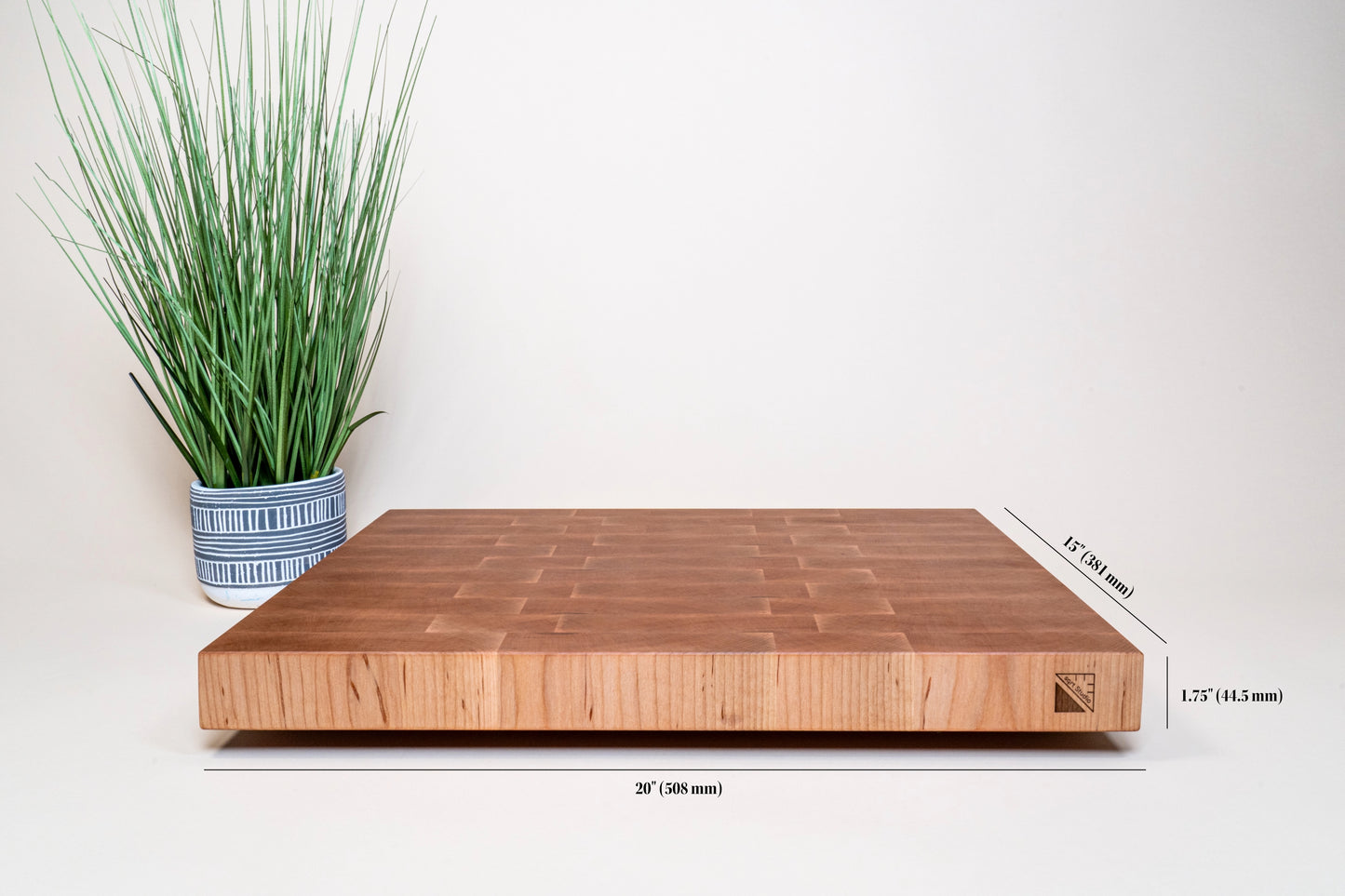 Extra large maple cutting board resistant to cut marks, self-healing cutting board due to the end-grain features, eco-friendly cutting board, sustainable cutting board, easy healthy choice for your kitchen, BPA-free cutting board, extra large 20x15 maple cutting board engraved with the Square Root Studio logo on the side, cutting board with rubber feet for a non-slip chef experience, cutting board with dimensions